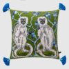 Forest green velvet cushion pillow cover with double-sided white monkeys, blue tree print, and blue tassels.