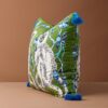 Forest green velvet cushion pillow cover with double-sided white monkeys, blue tree print, and blue tassels.