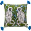 Forest green velvet cushion pillow cover with double-sided white monkeys, blue tree print, and blue tassels.