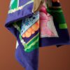 Dark blue micro velvet cushion cover featuring an orange jungle leopard on a pink sofa, green bamboo shelves, and oriental accents.