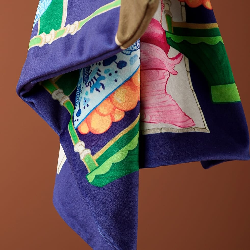 Dark blue micro velvet cushion cover featuring an orange jungle leopard on a pink sofa, green bamboo shelves, and oriental accents.