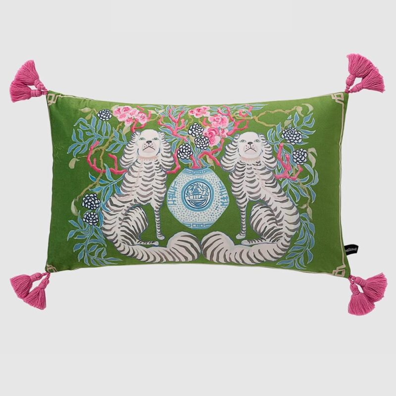 Green velvet lumbar pillow cover with white spaniel dogs, blue vase, and pink tassels.