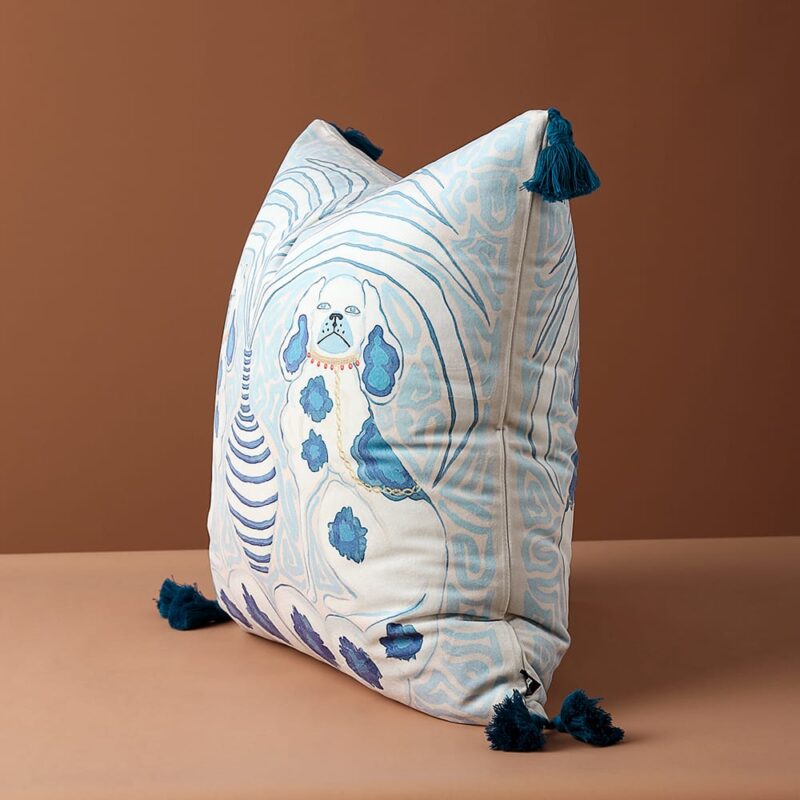 Velvet cushion pillow cover with organic light blue swirls, faded peach background, Victorian spaniel dogs, white-blue striped vase, and dark blue tassels