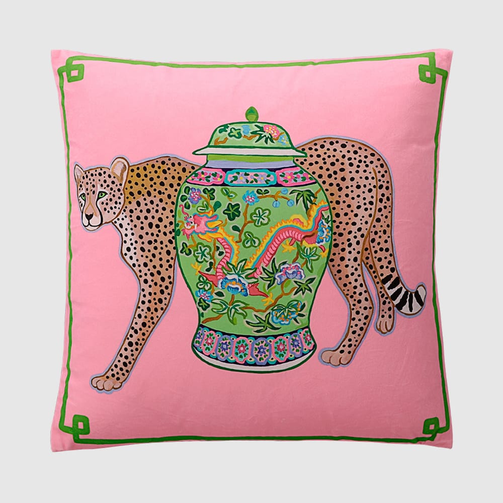 Pink micro velvet cushion cover with jungle leopard, antique porcelain jar, and green border.