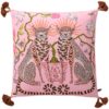 Pink velvet pillow cover with double-sided print of pink leopards, ceramic flower pot, white pigeons, butterflies, and rust tassels